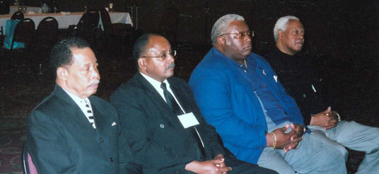 four men seated