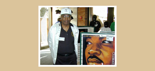Walkes with poster of MLK